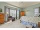 Serene bedroom with a bay window, plush carpet, and ample natural light at 42340 Kingsmill Cir, Elizabeth, CO 80107
