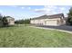 Exterior view of house with detached garage with large front yard at 42340 Kingsmill Cir, Elizabeth, CO 80107