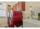 Functional laundry room with modern washer, dryer, and ample storage space at 42340 Kingsmill Cir, Elizabeth, CO 80107