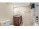 Well-lit bathroom with a granite vanity, and a shower with a curtain at 4544 W 69Th Ave, Westminster, CO 80030