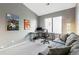 Neutral toned bedroom offering space for relaxation or home office with a vaulted ceiling and natural light at 7394 S Alkire St # 307, Littleton, CO 80127