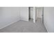 A bright bedroom features neutral carpet and a closet for ample storage at 10689 Uravan St, Commerce City, CO 80022