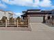 Charming home featuring a two-car garage, tasteful siding and rock landscaping at 10689 Uravan St, Commerce City, CO 80022