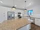Modern kitchen featuring stainless steel appliances, granite countertops, and center island at 10689 Uravan St, Commerce City, CO 80022