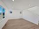 Spacious living room with hardwood floors and large windows at 10689 Uravan St, Commerce City, CO 80022