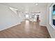 Open concept floor plan featuring living room and modern kitchen at 10689 Uravan St, Commerce City, CO 80022
