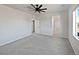 Bright main bedroom featuring neutral walls and a ceiling fan at 10689 Uravan St, Commerce City, CO 80022