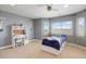 Well-lit bedroom with desk, carpet, ceiling fan and large window providing natural light and views at 223 Castlemaine Ct, Castle Rock, CO 80104