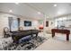 Spacious game room featuring a pool table, foosball, and comfortable seating at 223 Castlemaine Ct, Castle Rock, CO 80104
