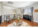 Second-floor living area with comfortable chairs and a piano, offering a relaxing space at 223 Castlemaine Ct, Castle Rock, CO 80104