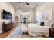 Spacious main bedroom featuring an en suite bathroom, and arched entrance to Gathering room at 223 Castlemaine Ct, Castle Rock, CO 80104