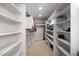 Organized walk-in closet with ample shelving and hanging space, providing plenty of storage at 223 Castlemaine Ct, Castle Rock, CO 80104