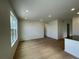 A bright living room is enhanced with wood flooring and large windows for natural light and style at 5085 N Quemoy St, Aurora, CO 80019