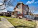 Charming two-story home boasts a well-manicured lawn and a classic design, enhancing its curb appeal at 342 Olympia Ave, Longmont, CO 80504