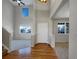 Grand foyer entrance with high ceilings, hardwood floors, and abundant natural light at 342 Olympia Ave, Longmont, CO 80504