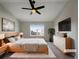 Cozy main bedroom featuring a large window and modern furnishings, creating a comfortable retreat at 342 Olympia Ave, Longmont, CO 80504