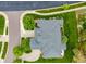 An aerial view of the home's roof, yard with beautiful landscaping, and driveway at 8267 S Sicily Ct, Aurora, CO 80016