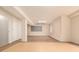 Unfinished basement space with tile flooring, ample lighting, and convenient closet access at 8267 S Sicily Ct, Aurora, CO 80016