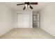 Bright bedroom with a ceiling fan and large closet, offering ample storage space at 8267 S Sicily Ct, Aurora, CO 80016