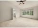 Bright, spacious bedroom featuring a ceiling fan, carpet, neutral walls, and large windows at 8267 S Sicily Ct, Aurora, CO 80016