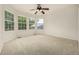 Large bedroom with carpet and large windows at 8267 S Sicily Ct, Aurora, CO 80016