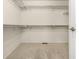 Organized walk-in closet featuring built-in shelving and rods for ample storage space at 8267 S Sicily Ct, Aurora, CO 80016