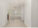 Clean entryway with tile flooring flowing into a spacious living area filled with natural light at 8267 S Sicily Ct, Aurora, CO 80016