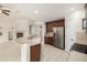 Modern kitchen featuring a breakfast bar, stainless steel appliances, and open access to the living area at 8267 S Sicily Ct, Aurora, CO 80016