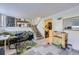 Finished basement with tile floors, stairs leading to the upper level and a laundry area at 18891 E Carmel Dr, Aurora, CO 80011