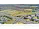 Aerial view of a neighborhood with green spaces, ponds, and easy access to the golf course at 3090 W 107Th Pl # F, Westminster, CO 80031