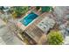 Aerial view of a house with a fenced backyard, covered pool and mature trees at 3090 W 107Th Pl # F, Westminster, CO 80031
