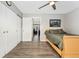 Cozy bedroom featuring a ceiling fan, closet, and natural light at 3090 W 107Th Pl # F, Westminster, CO 80031