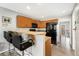 Traditional kitchen with wooden cabinets, granite countertops and a bar with seating for casual dining at 3090 W 107Th Pl # F, Westminster, CO 80031