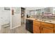 Bright kitchen featuring wood cabinets, granite countertops, and black appliances at 3090 W 107Th Pl # F, Westminster, CO 80031
