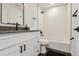 Renovated bathroom with sleek, black fixtures and white subway tile at 717 Inca St, Denver, CO 80204
