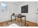Bright office space with a modern desk, minimalist decor, and natural light from a window at 717 Inca St, Denver, CO 80204