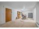 Spacious basement featuring carpeted floors, a wooden hutch, and a safe at 4724 Hopi Rd, Indian Hills, CO 80454