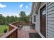 Cozy deck furnished with outdoor seating and a small table, adjacent to the home's entrance at 4724 Hopi Rd, Indian Hills, CO 80454