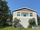 Charming home exterior showcases well-maintained siding and complemented by lush greenery at 4724 Hopi Rd, Indian Hills, CO 80454