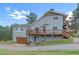 Two story home with a garage and deck at 4724 Hopi Rd, Indian Hills, CO 80454
