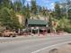 Rustic two-story mountain home offering main street frontage and an abundance of possibilities at 4724 Hopi Rd, Indian Hills, CO 80454