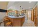 Bright eat-in kitchen with granite countertops, stainless appliances, and wood cabinets at 4724 Hopi Rd, Indian Hills, CO 80454
