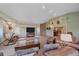 Spacious living room with vaulted ceilings, carpeted floors, and natural light at 4724 Hopi Rd, Indian Hills, CO 80454