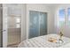 Cozy bedroom featuring a sliding door closet and tranquil natural light at 3384 Cranston Cir, Highlands Ranch, CO 80126