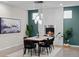Cozy dining room with a fireplace, modern lighting, and a view of the outdoors at 3384 Cranston Cir, Highlands Ranch, CO 80126