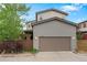 Two-story house with attached two car garage, manicured landscaping and partial fence at 3384 Cranston Cir, Highlands Ranch, CO 80126