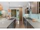 Bright, open kitchen boasts stainless steel appliances, a large island, and access to the outdoors at 3384 Cranston Cir, Highlands Ranch, CO 80126