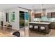 Modern kitchen equipped with stainless steel appliances, a center island with seating, and direct patio access at 3384 Cranston Cir, Highlands Ranch, CO 80126