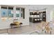 The living area flows into a kitchen with a center island and modern appliances, creating a perfect gathering space at 3384 Cranston Cir, Highlands Ranch, CO 80126