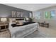 Comfortable main bedroom with large windows and stylish decor at 3384 Cranston Cir, Highlands Ranch, CO 80126
